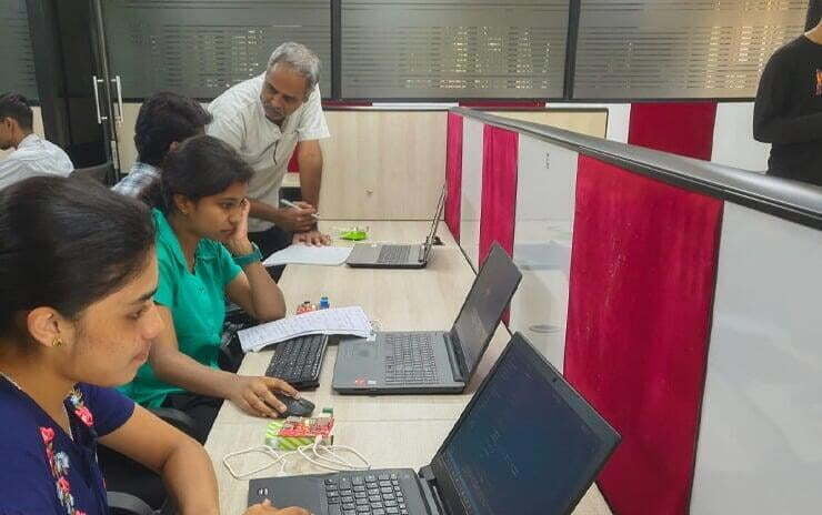 Image of working professionals being upskilled